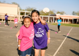 Two Girls on the Run participants pose for the camera at practice